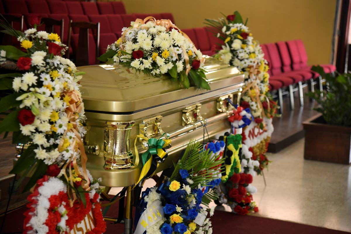 The coffin containing the remains of Dervan Malcolm at the funeral.